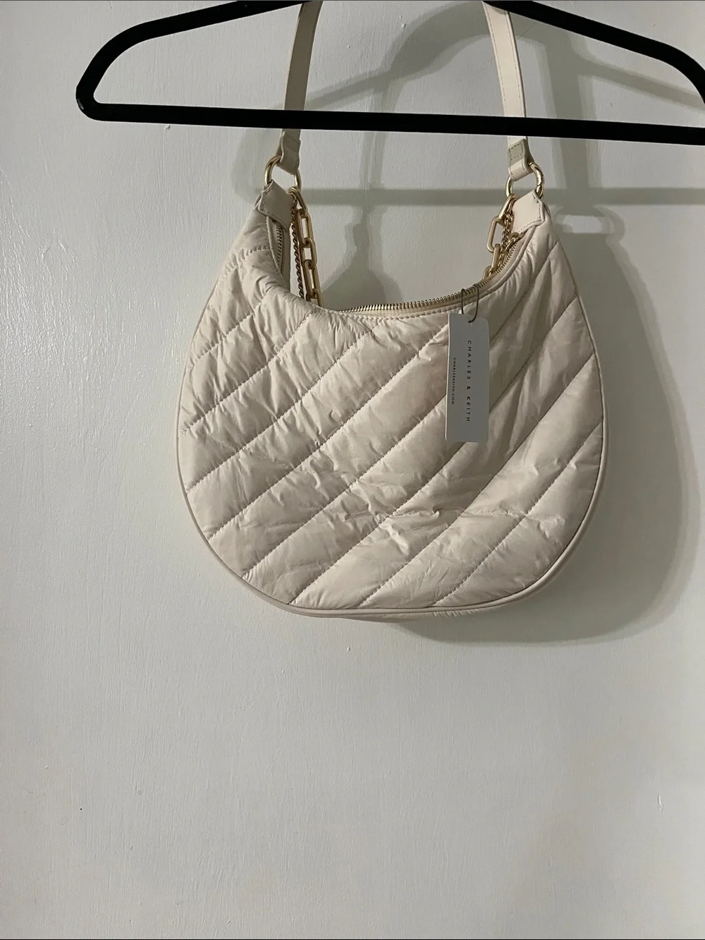 Charles & Keith Cream Quilted Crescent Bag with Gold Chains